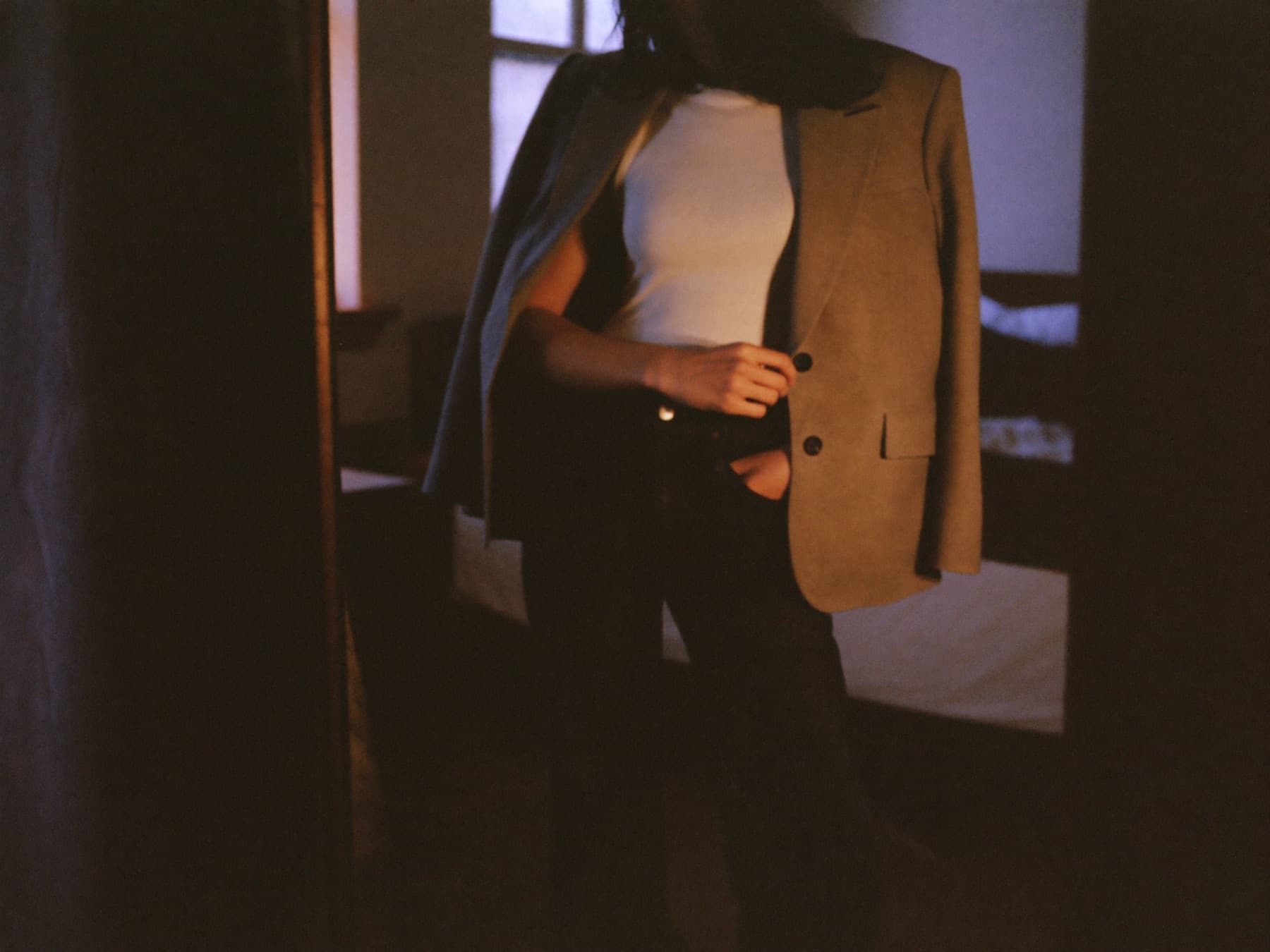 A finished outfit seen in a mirror